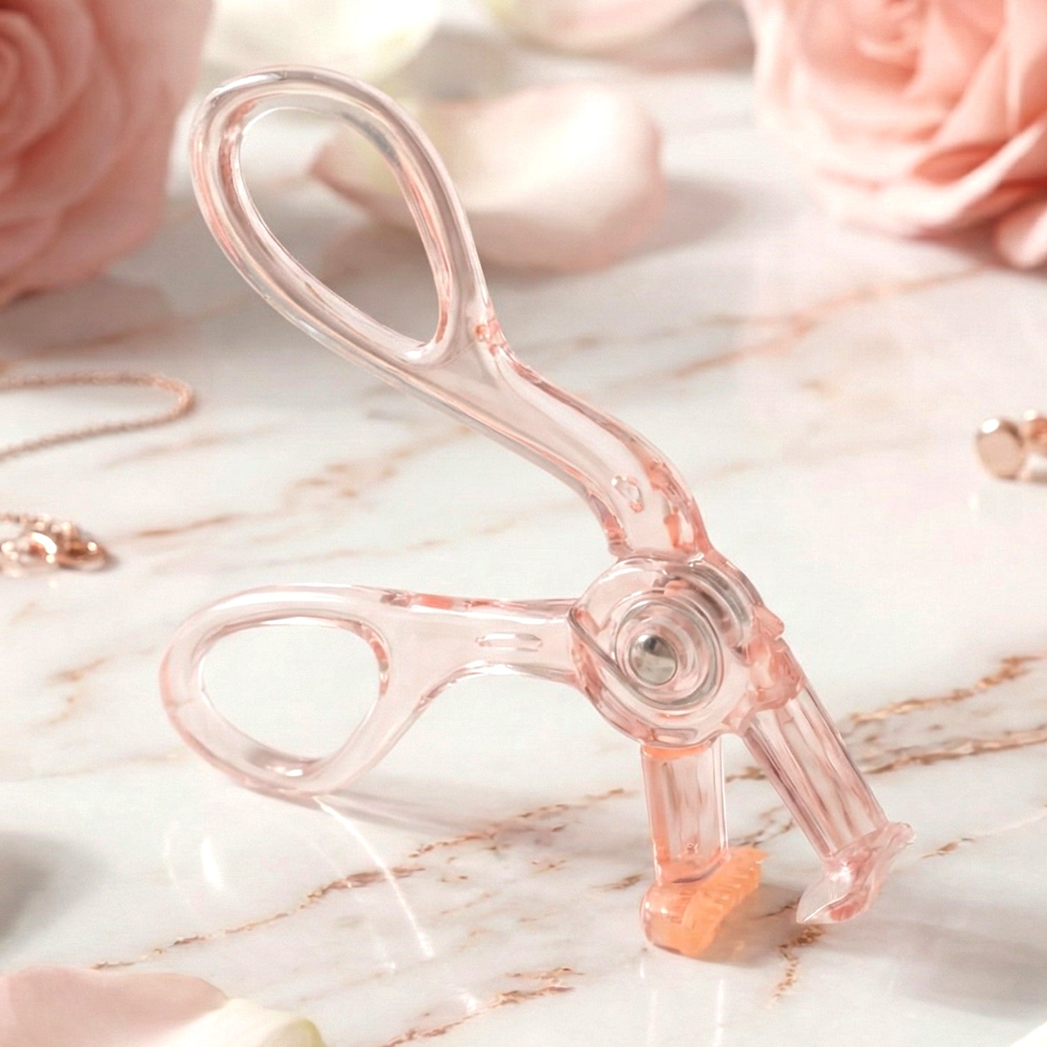 Wukusy premium transparent plastic eyelash curler with metal clamp and soft pads, designed for gentle, precise eyelash curling.