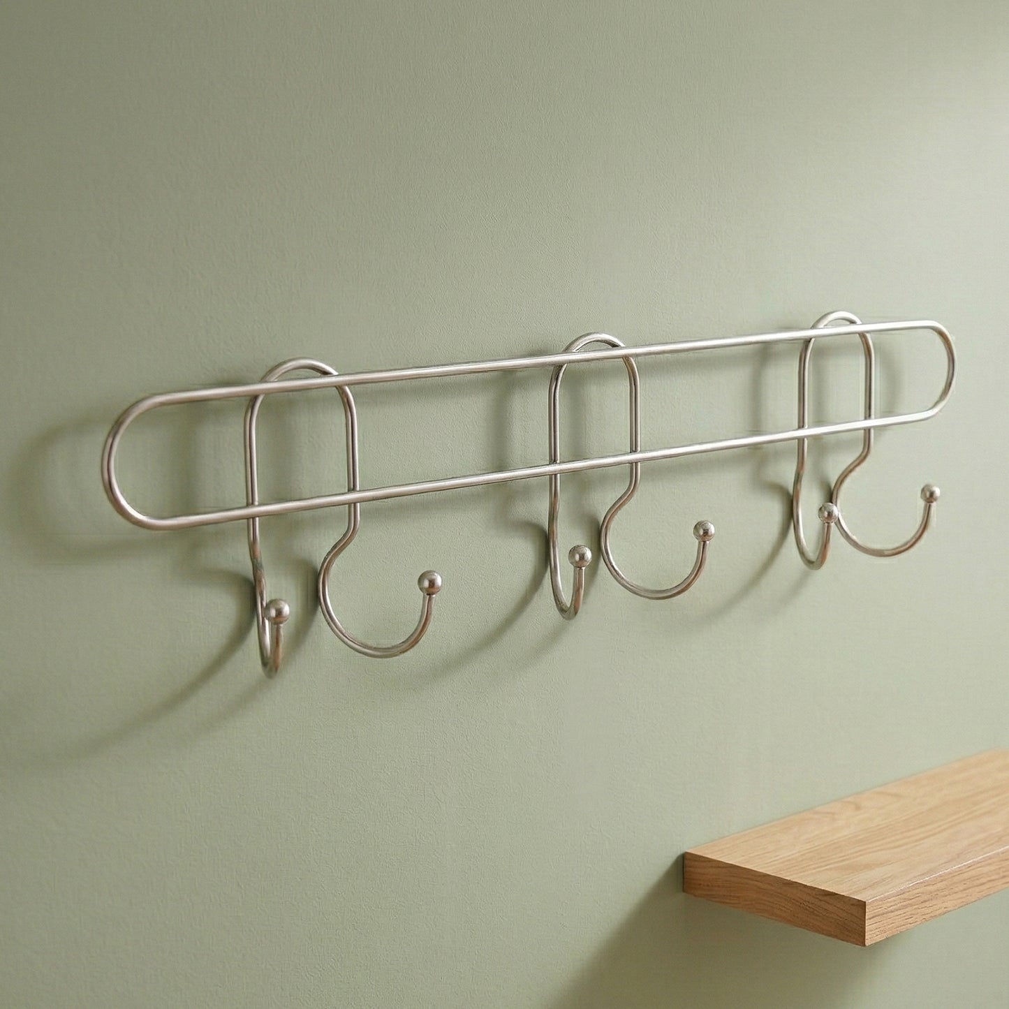 Wukusy premium wall-mounted metal multi-hook rack with multiple hooks for organizing coats, hats, and accessories.