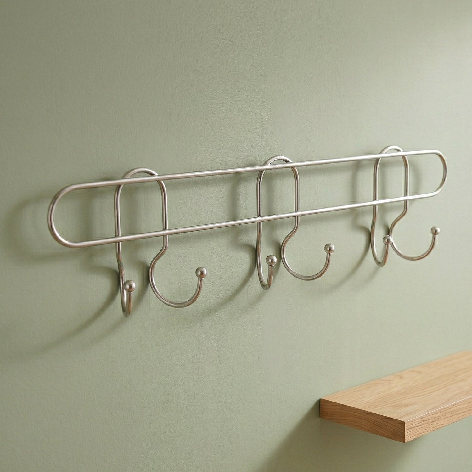 Wukusy premium wall-mounted metal multi-hook rack with multiple hooks for organizing coats, hats, and accessories.