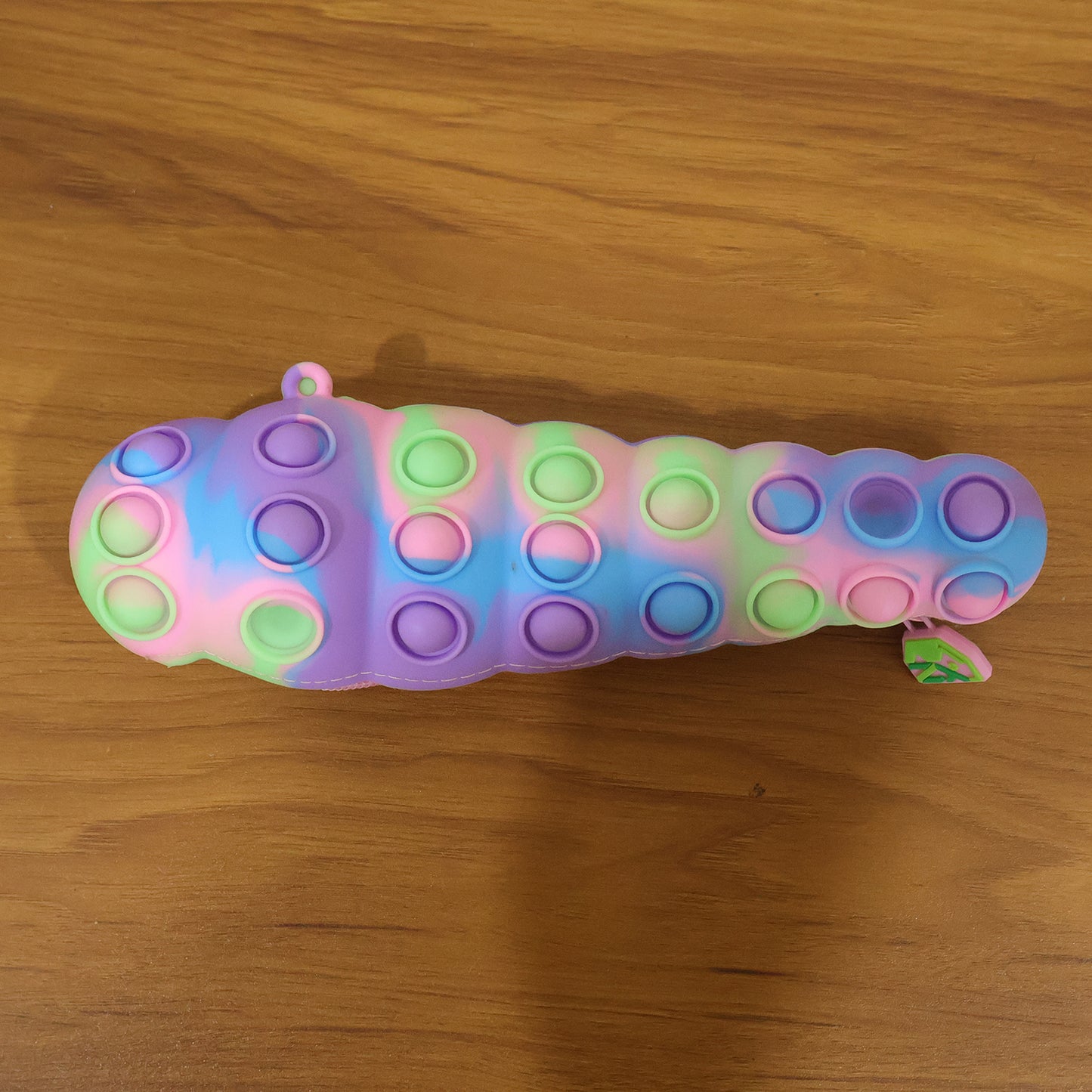 Rainbow Caterpillar Pop It Toy by Wukusy featuring colorful silicone bubbles for sensory fun and stress relief.