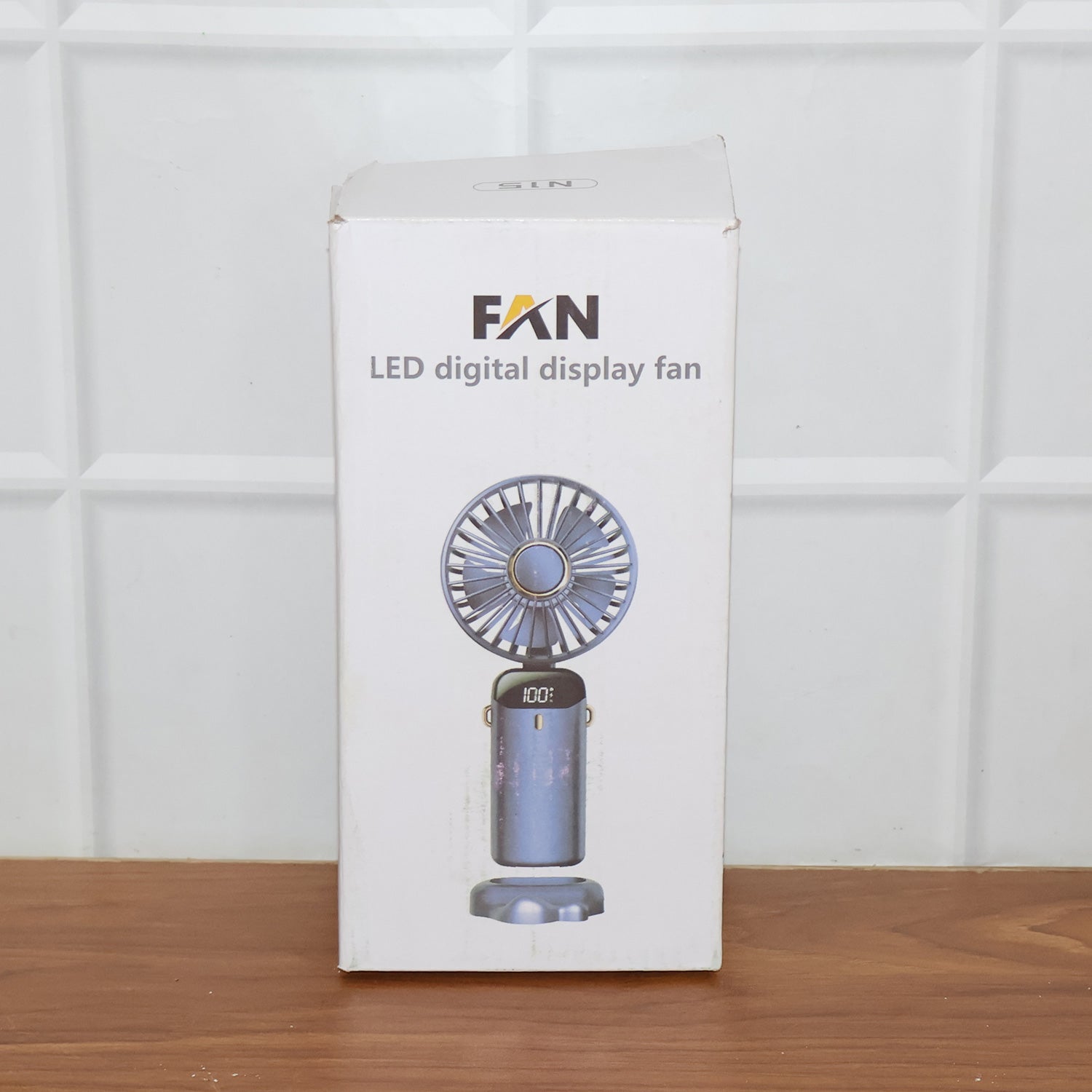 Wukusy rechargeable portable handheld fan, compact and lightweight with adjustable settings, ideal for outdoor use.