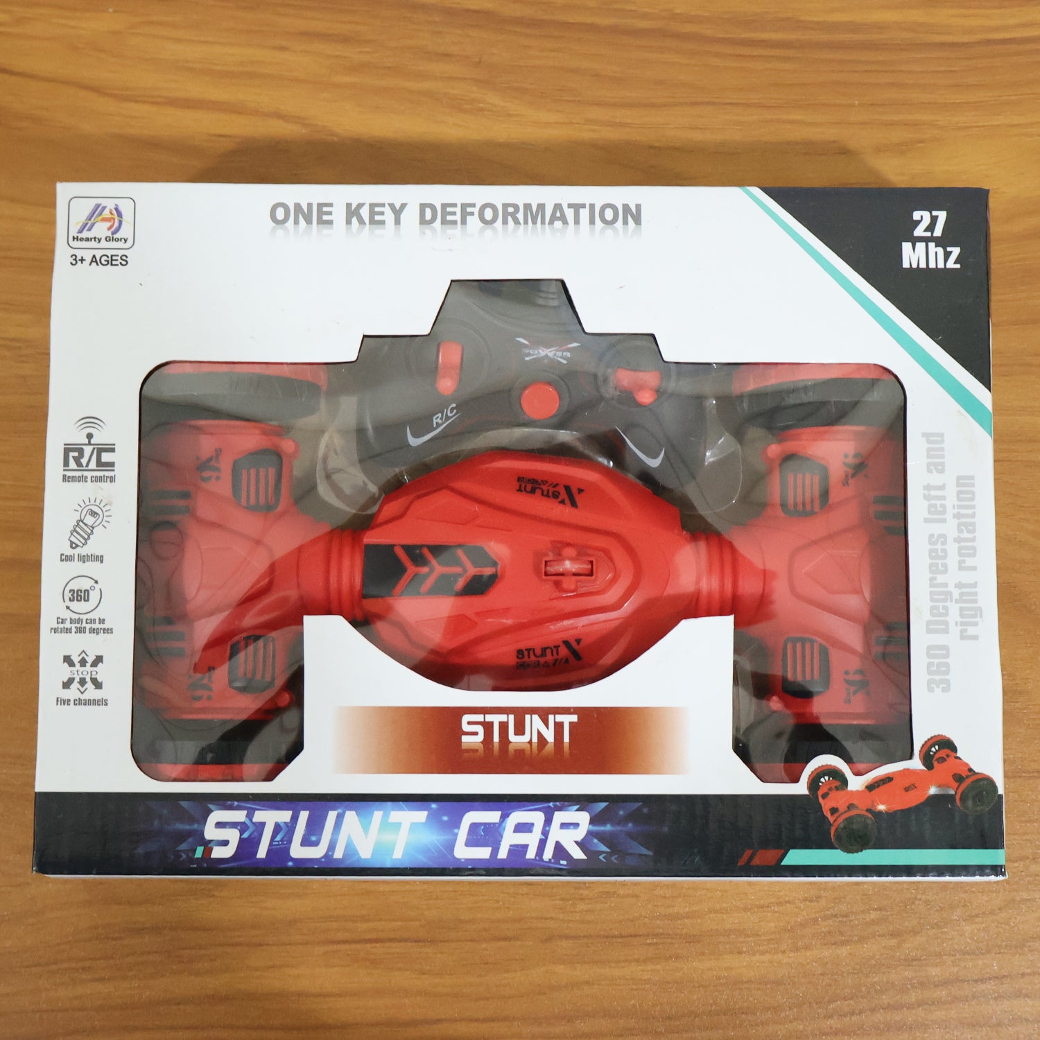 Wukusy remote control stunt car with one-key deformation, shown in action on smooth surface, colorful design, and compact size.