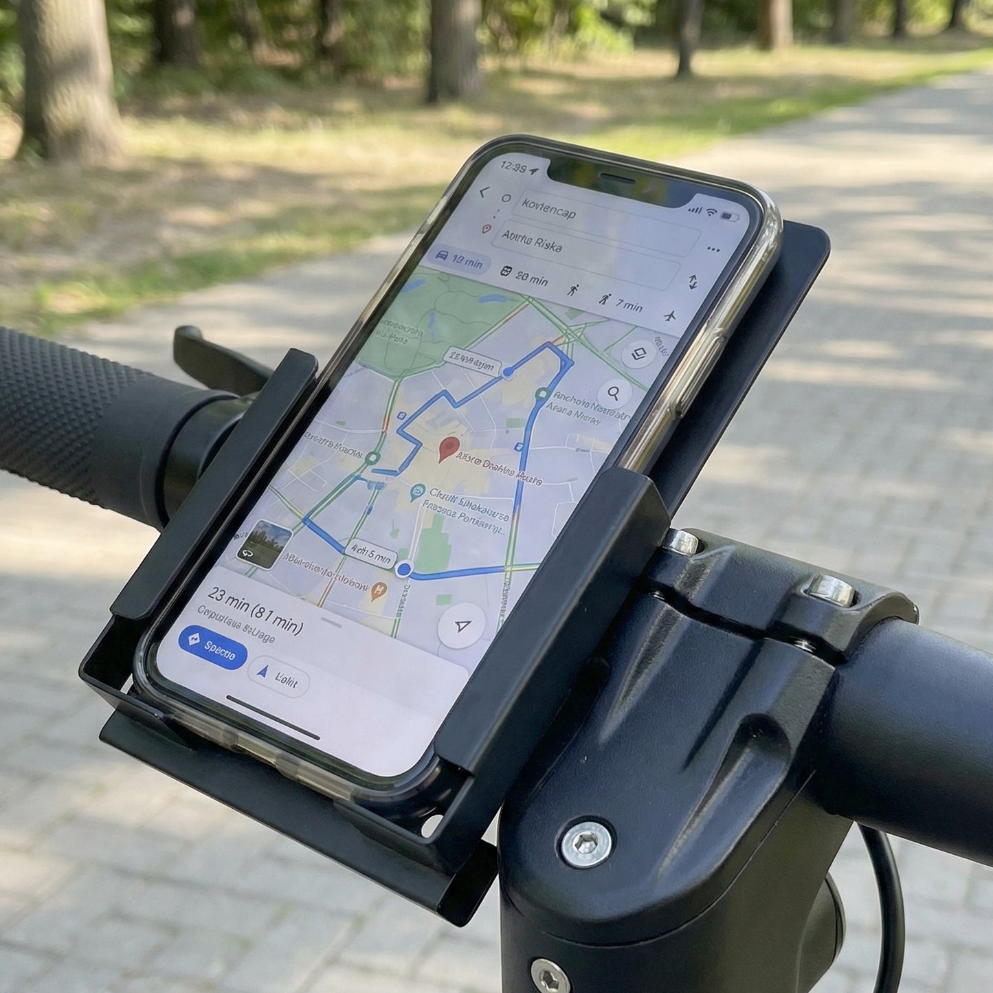Wukusy Rixa Bracket Mobile Holder mounted on a surface, showing its adjustable design and secure grip for smartphones.