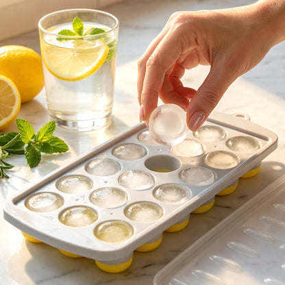 Wukusy round ball ice cube tray with lid, 21-grid ice mold tray for making spherical ice cubes in a kitchen or bar setting.