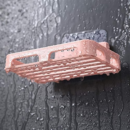 Wukusy self-adhesive rectangular soap dish holder mounted on a bathroom wall, designed for convenient soap storage and drainage.