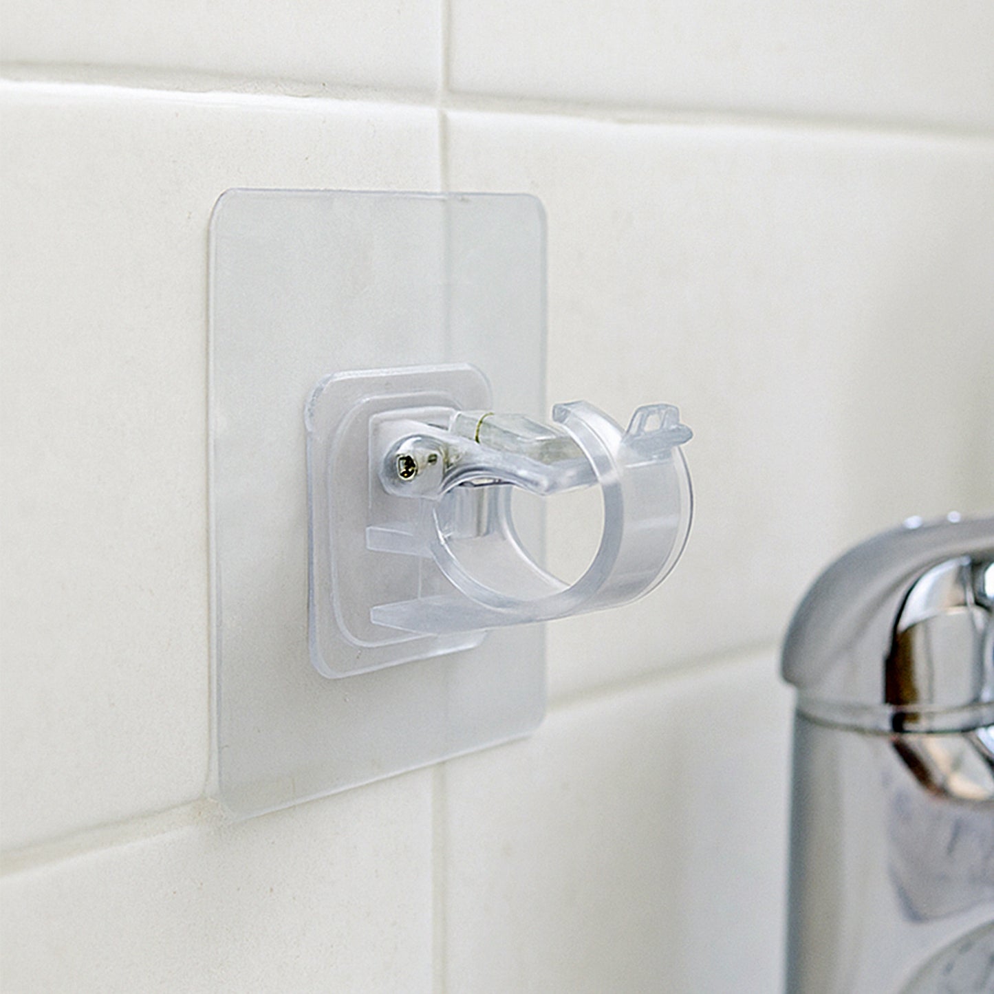 Transparent self-adhesive wall hook holder clip by Wukusy, suitable for hanging lightweight items on smooth surfaces.