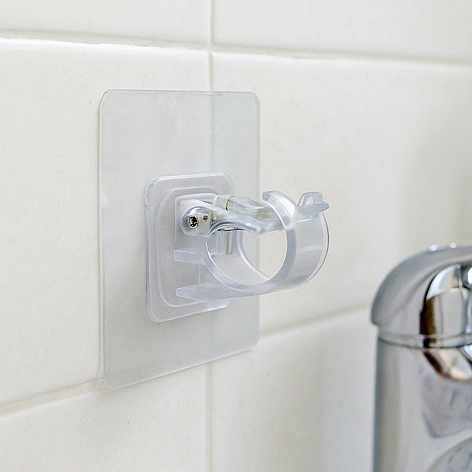 Transparent self-adhesive wall hook holder clip by Wukusy, suitable for hanging lightweight items on smooth surfaces.