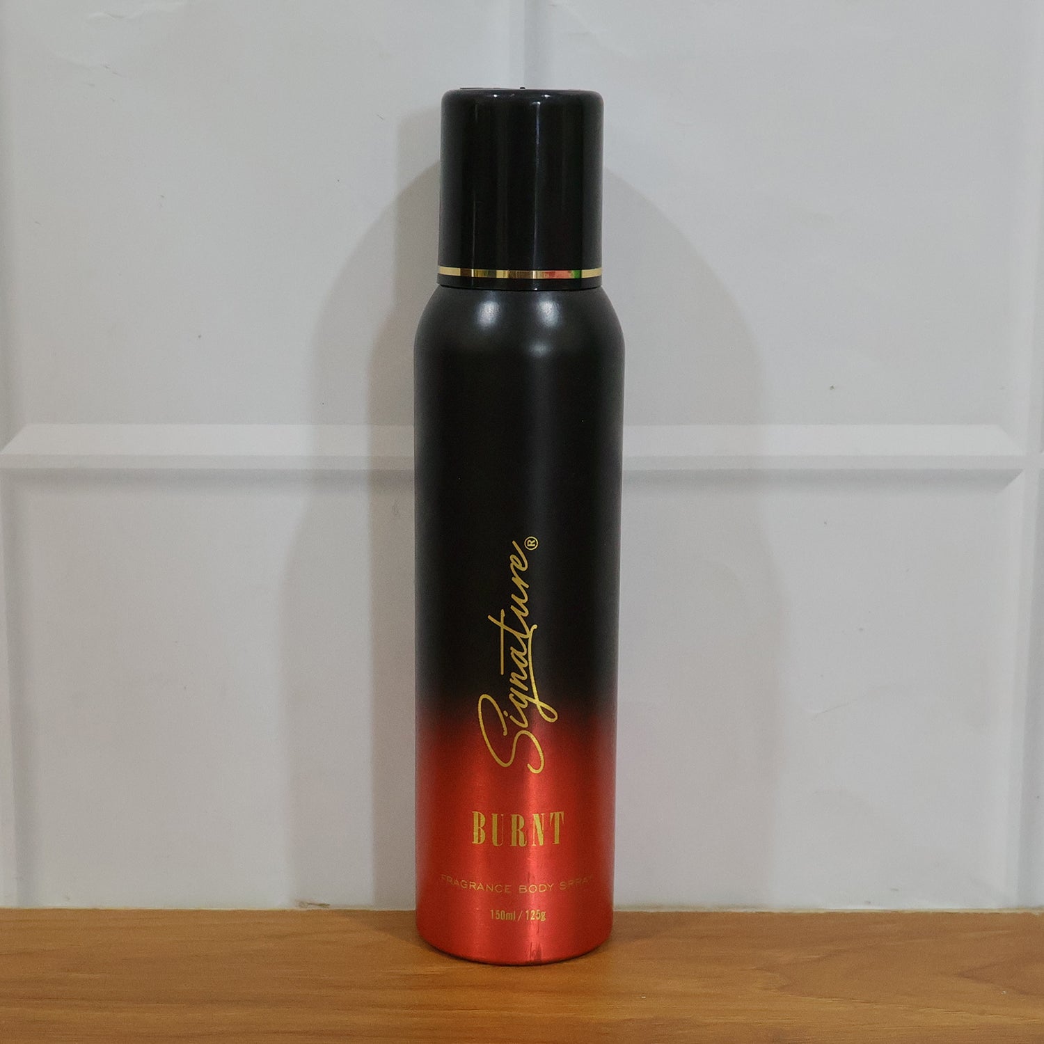 Wukusy Signature Premium Burnt Fragrance Body Spray for Men, 150ml, featuring a sleek bottle and dark label design.