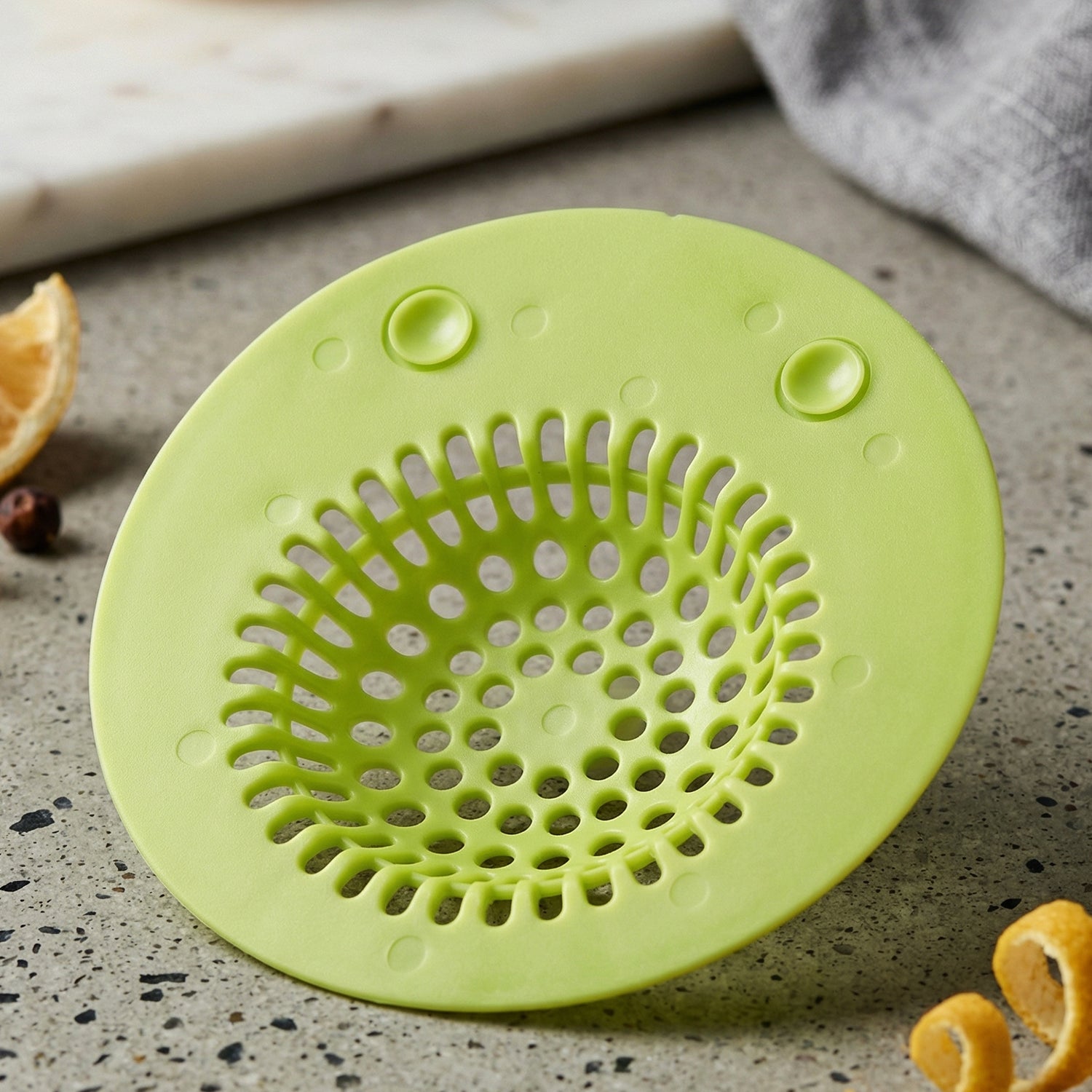 Wukusy silicone sink drain strainer in black, designed to catch debris and prevent clogs in kitchen or bathroom sinks.