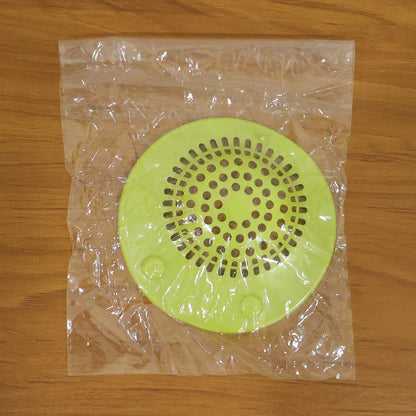 Wukusy silicone sink drain strainer in use, catching debris to prevent clogs in kitchen sink.