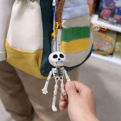 Two Wukusy skeleton doll keychains with metal hooks, featuring detailed bone design on durable metal keychains.