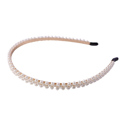 Elegant Wukusy slim pearl hairband for women, featuring a sleek design with pearl accents, ideal for stylish hair accessories.