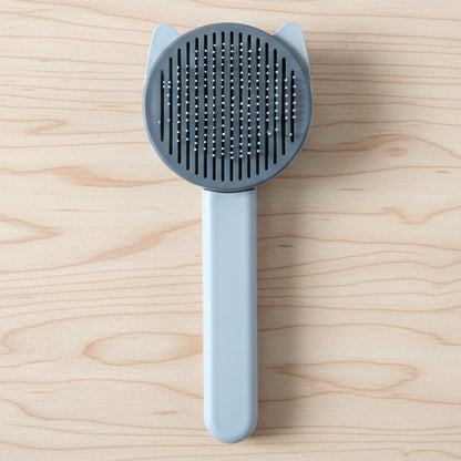 Wukusy soft pet hair removal needle comb for grooming and detangling cats and dogs, with fine metal needles for gentle use.