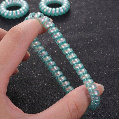 Set of five colorful Wukusy soft stretchable telephone wire style hair bands, ideal for gentle hair styling and secure hold.