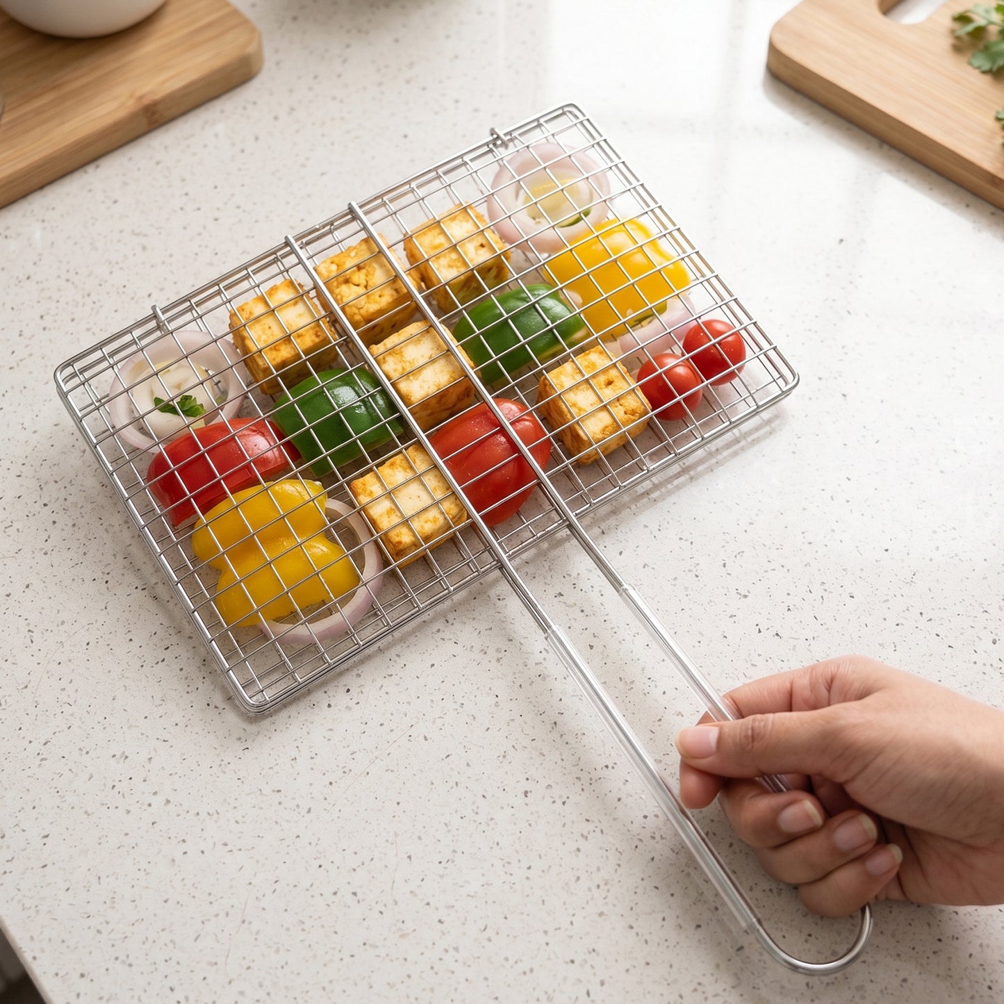 Wukusy stainless steel foldable BBQ grill wire mesh with handle, ideal for grilling, with a sturdy handle for easy use.