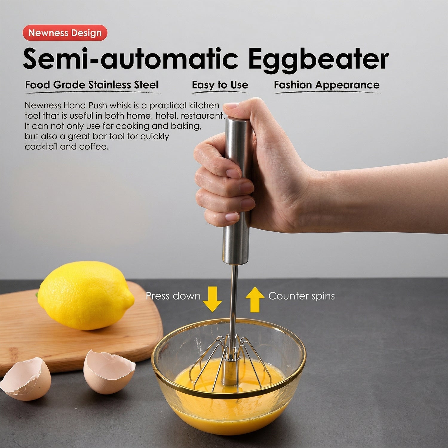 Wukusy stainless steel hand push rotary whisk, 29 cm, with a sleek metal handle and rotary mechanism for mixing and whisking.
