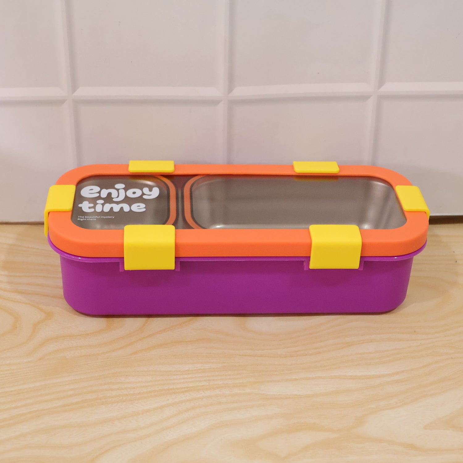 Wukusy stainless steel leak-proof lunch box with two compartments, spoon, and fork for portable meal storage.