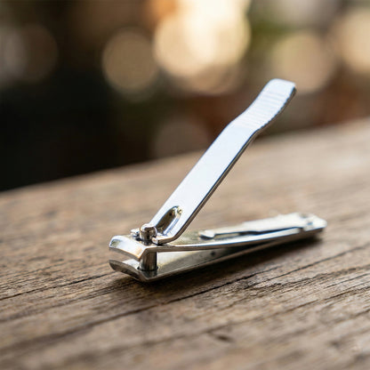 Wukusy stainless steel nail clipper set with two nail clippers and keychain holder on white background