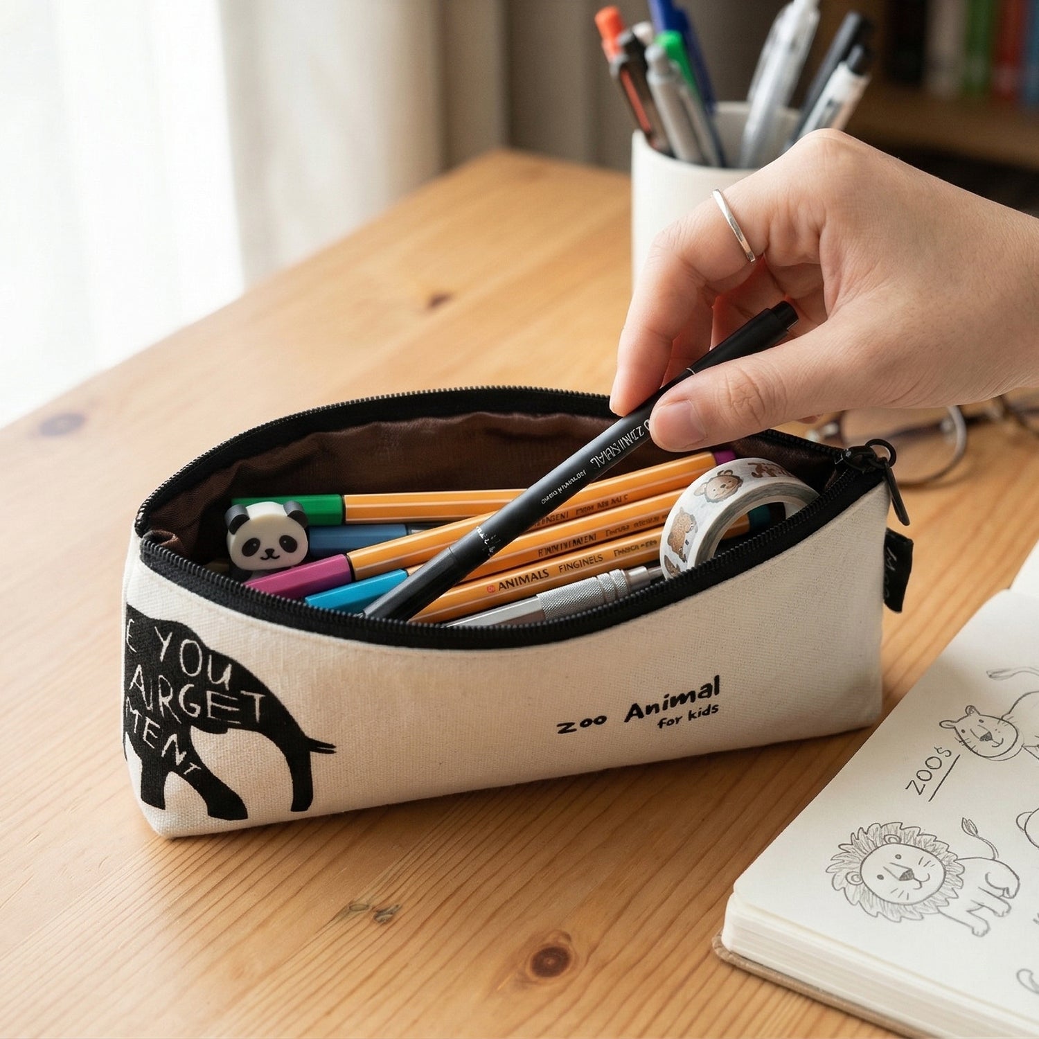 Wukusy stylish canvas pencil pouch, 1-piece, with zipper closure and colorful design for organizing pens and stationery.