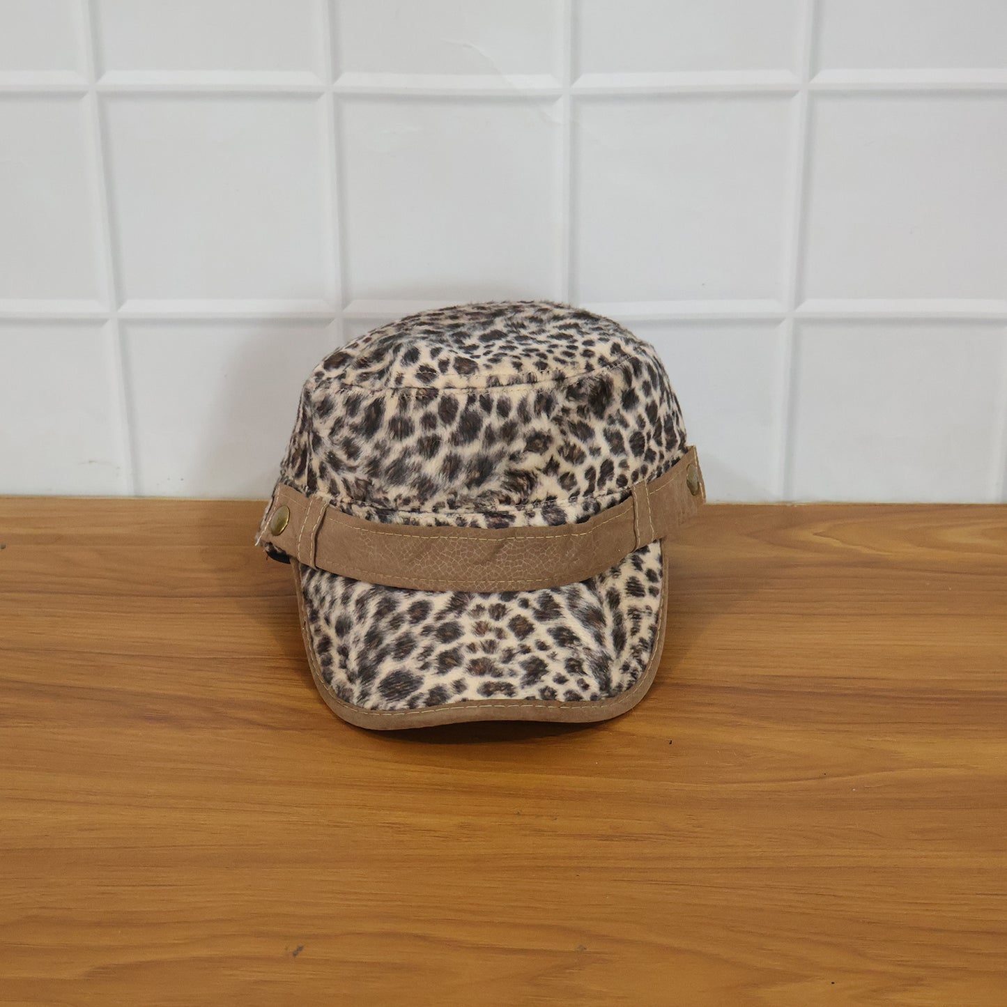 Wukusy stylish leopard print military style cap with brim, adjustable strap, and bold pattern on durable fabric.
