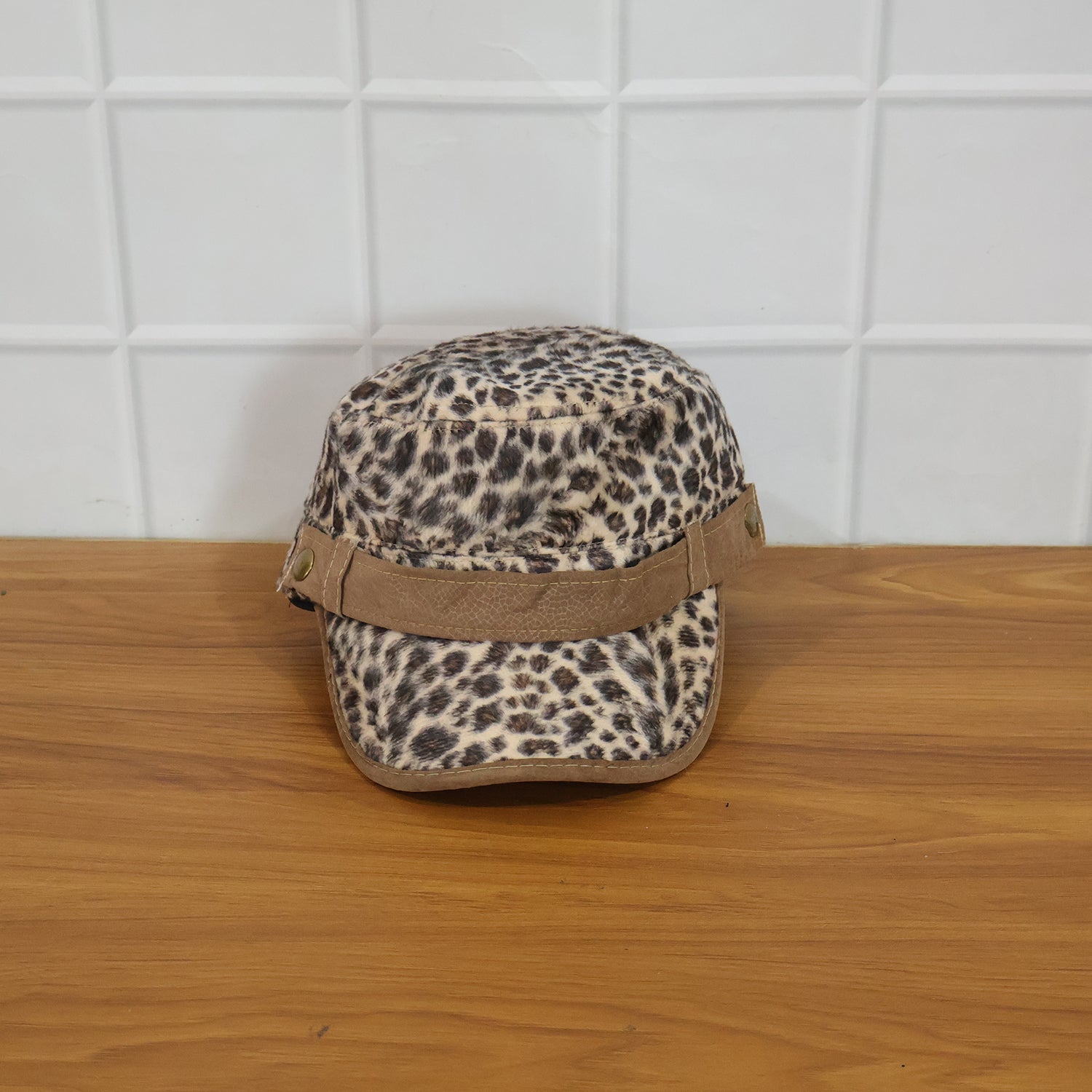 Wukusy stylish leopard print military style cap with brim, adjustable strap, and bold pattern on durable fabric.