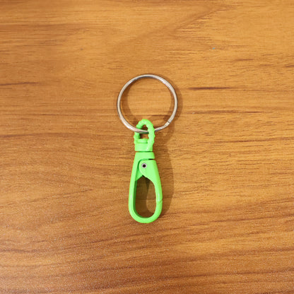 Super strong mini plastic carabiner keychain by Wukusy in mixed colors, perfect for keys and small accessories.
