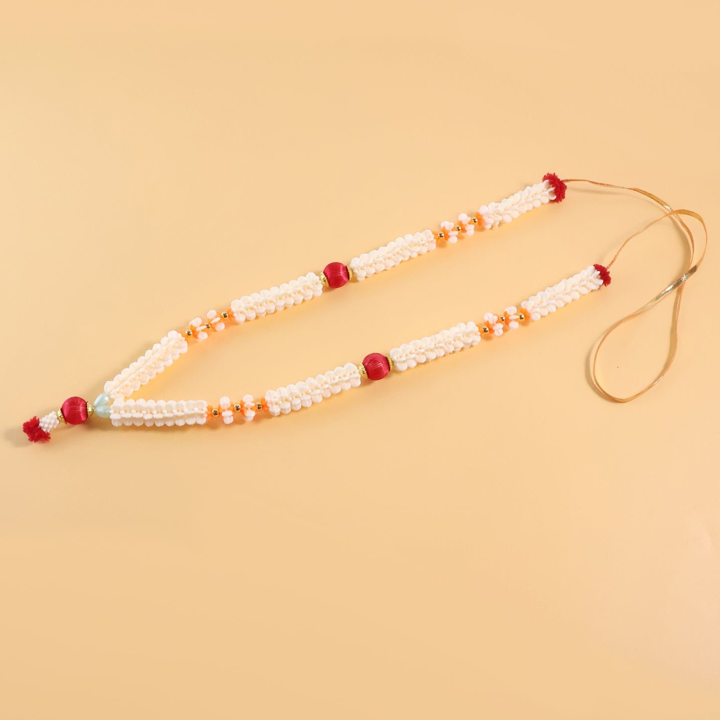 Traditional decorative Pooja Gajra garland by Wukusy, featuring vibrant flowers for religious and festive celebrations.