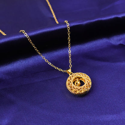 Gold-tone round Jhumka pendant chain necklace by Wukusy, traditional jewelry with intricate design, on a plain background.