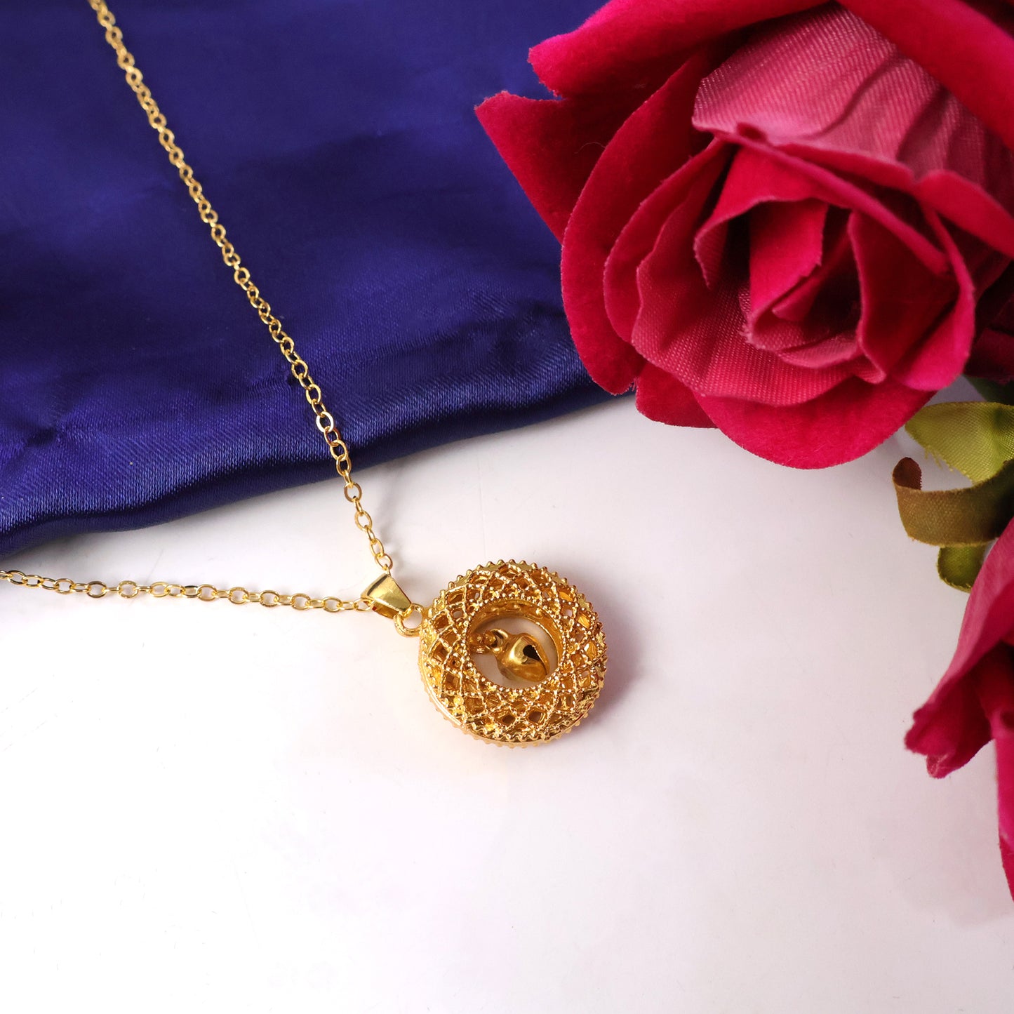 Gold-tone round Jhumka pendant chain necklace by Wukusy featuring traditional Indian jewelry style, with intricate design and elegant finish.