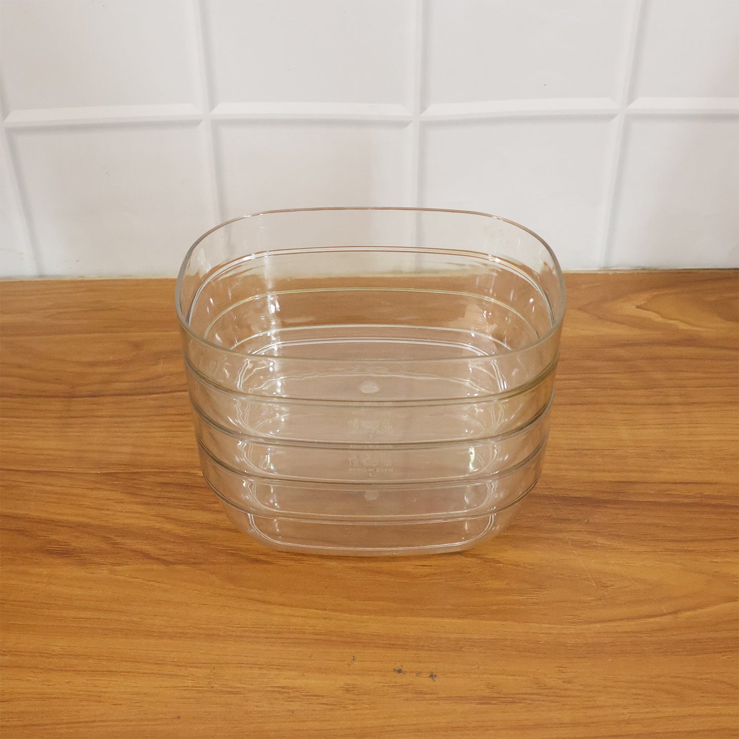 Set of four transparent Wukusy multipurpose serving bowls, ideal for salads, snacks, or side dishes in clear, durable glass.