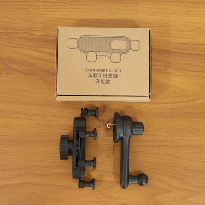 Wukusy universal car air vent mobile phone holder attached to a car vent, holding a smartphone securely.