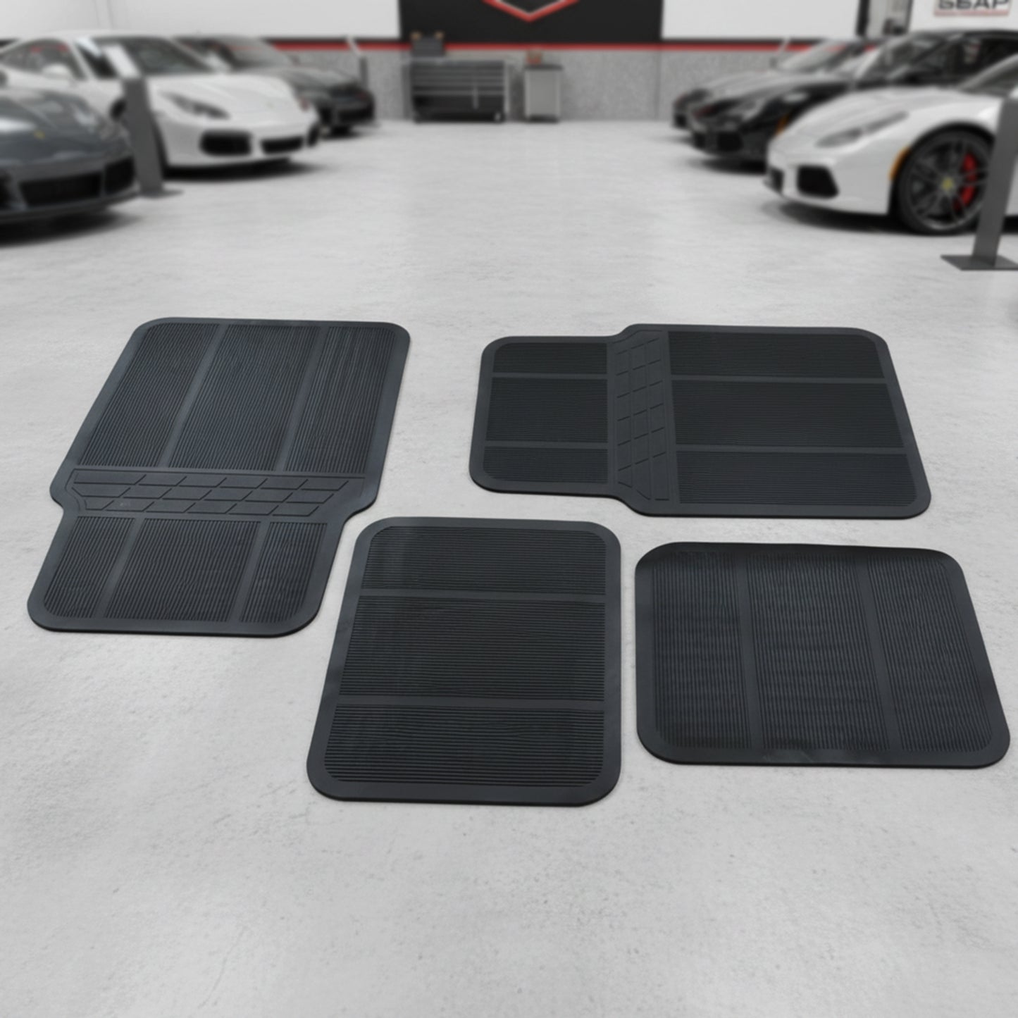 Wukusy universal car floor mat set with four black rubber mats, designed to fit most vehicle interiors.