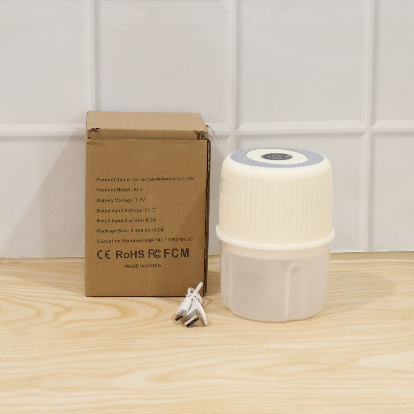 Wukusy USB rechargeable mini garlic chopper and crusher in 300 ml capacity, compact kitchen tool with stainless steel blades.