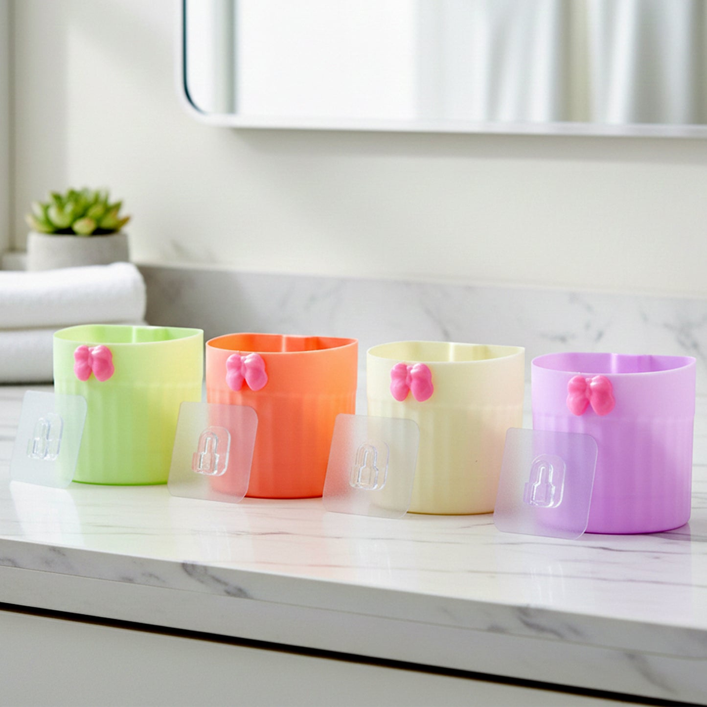 Wall-mounted bathroom toothbrush holder set by Wukusy, includes four durable plastic holders for toothbrushes and toothpaste.