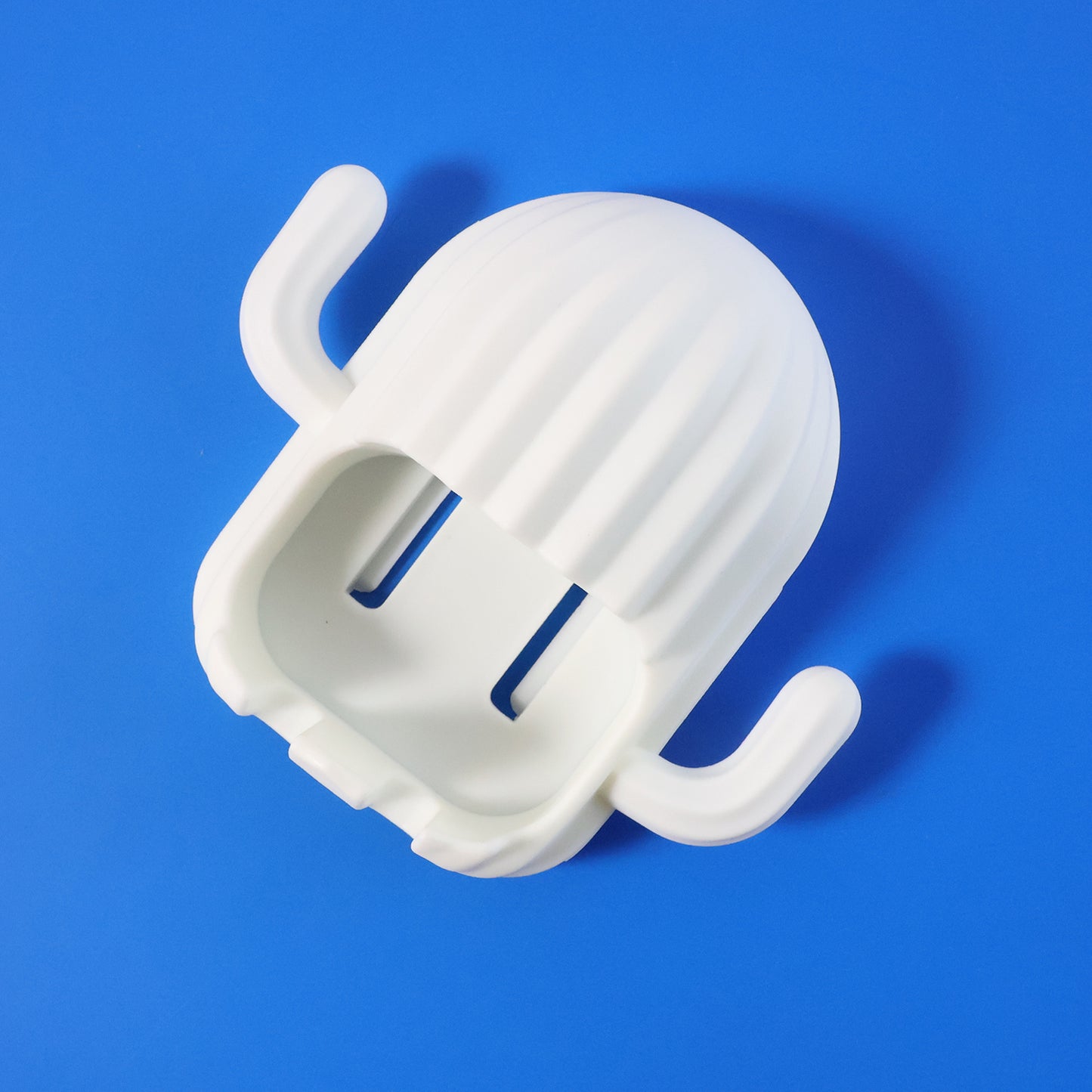 Wall-mounted cactus-shaped toothbrush holder by Wukusy, designed to hold toothbrushes in a fun, decorative cactus style.