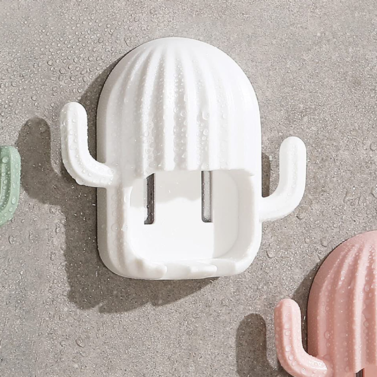 Wall-mounted cactus-shaped toothbrush holder by Wukusy, featuring a playful cactus design for bathroom organization.