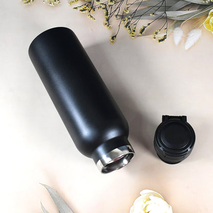 Wukusy insulated stainless steel water bottle for kids, 650 ml, with colorful design and leak-proof lid.