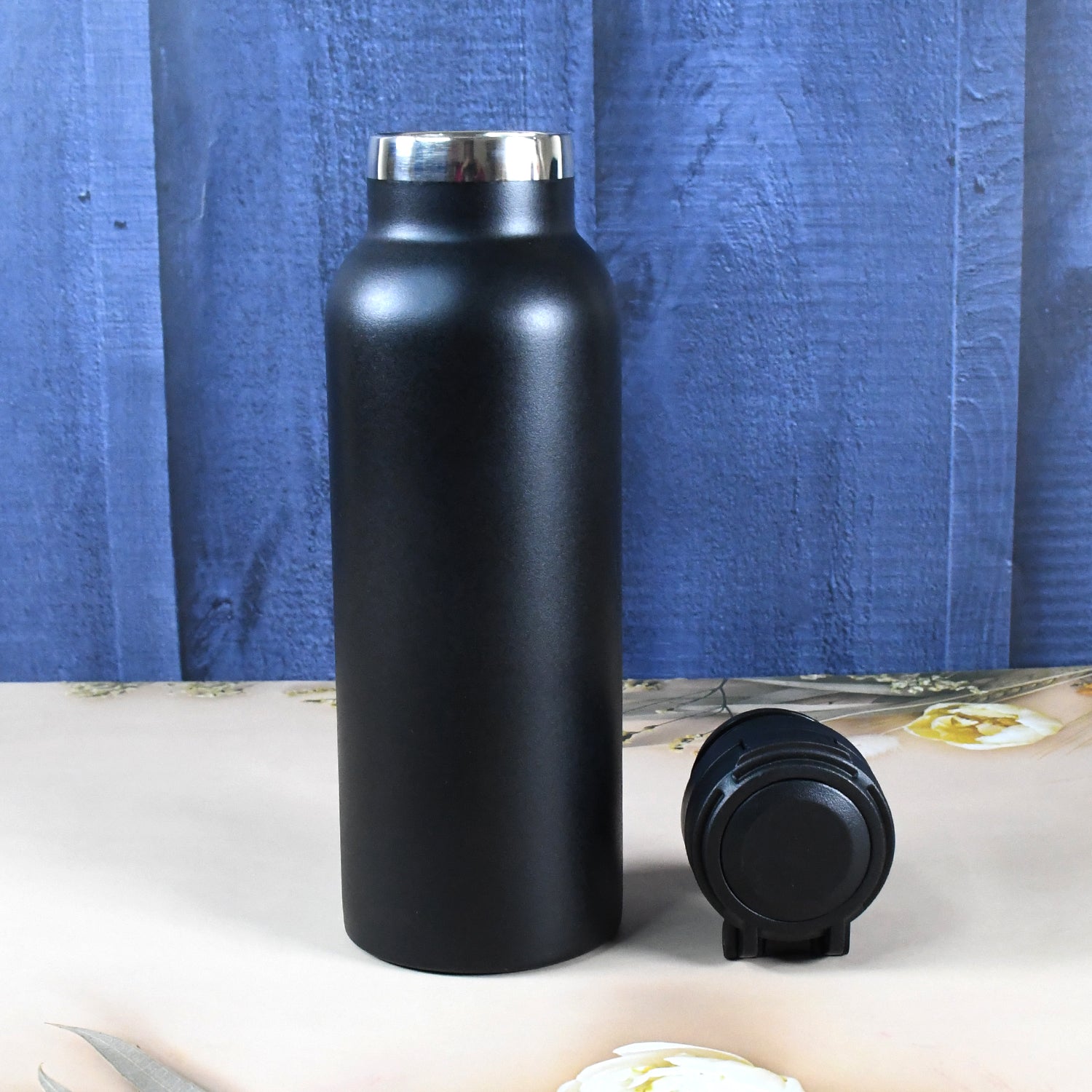 Wukusy insulated stainless steel water bottle for kids, 650ml, with colorful design and secure lid for daily hydration.