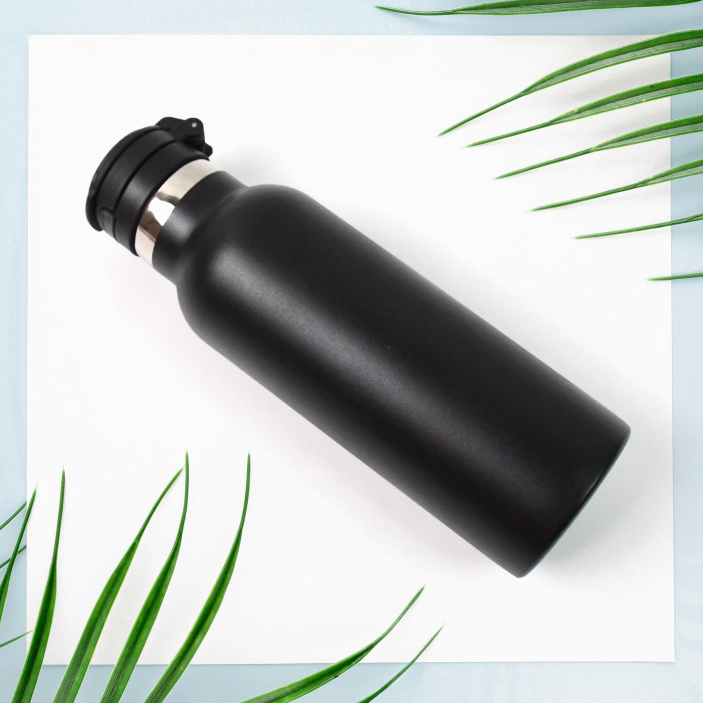 Insulated stainless steel water bottle for kids, 650ml capacity, from Wukusy, featuring a colorful design and spill-proof lid.