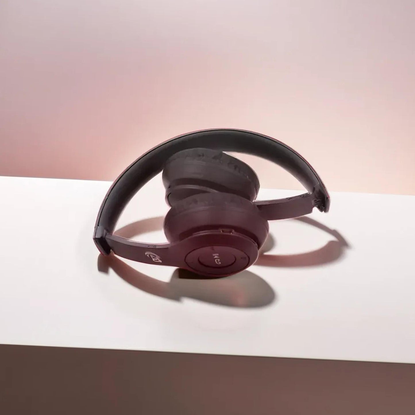 Wukusy wireless over-ear Bluetooth headphones with foldable headband, hands-free calling, black electronic headset.