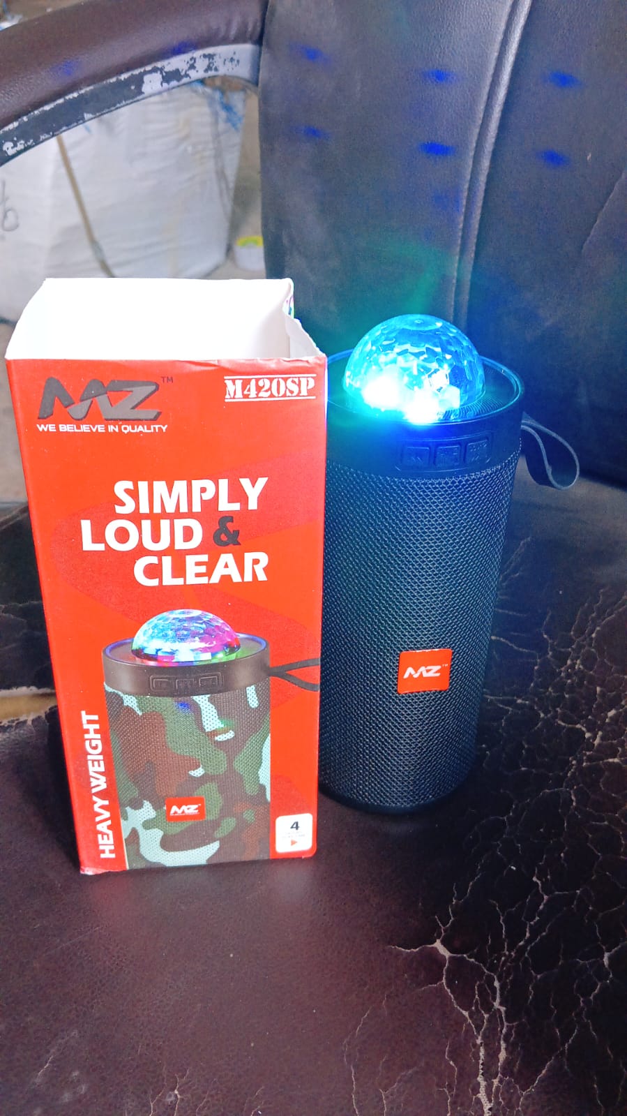 Wukusy 3D disco light sound Bluetooth speaker showing colorful LED lights and compact electronic design.