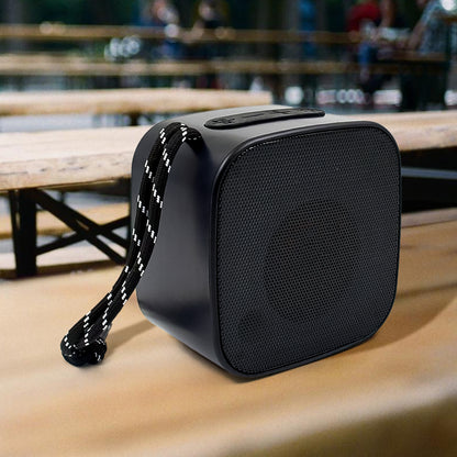 Wukusy portable mini wireless Bluetooth speaker in multicolor, compact electronic device with speaker grille and control buttons.