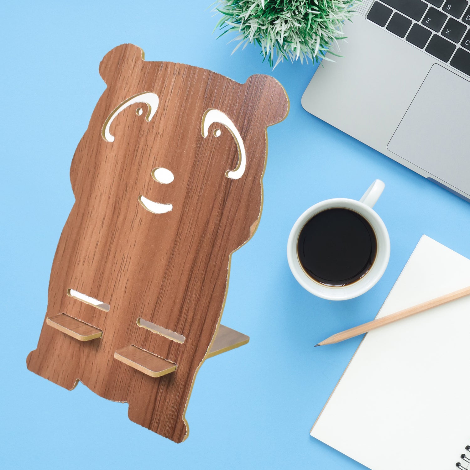 Wooden cartoon shape design mobile stand by Wukusy for holding smartphones, featuring a playful, decorative wooden shape.