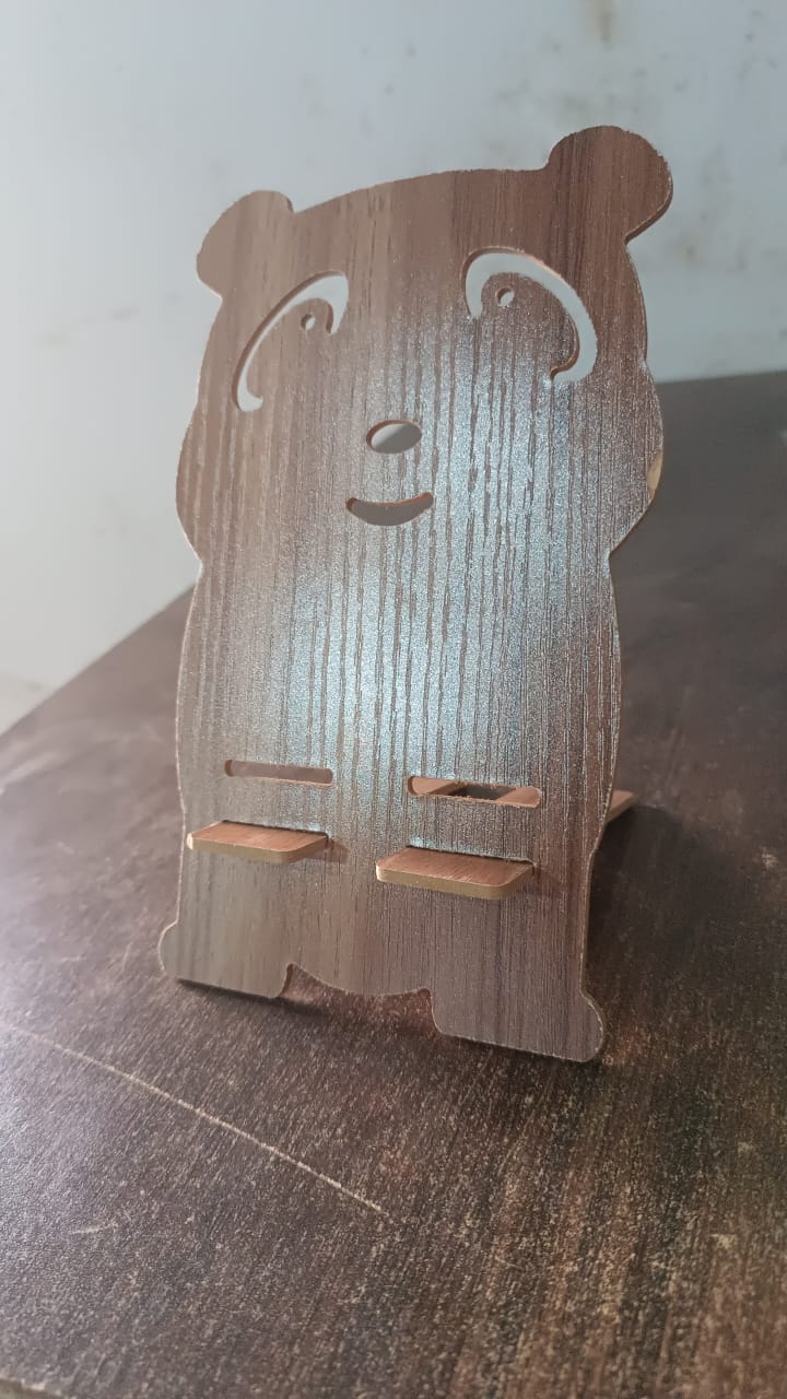 Wooden cartoon shape design mobile stand by Wukusy, perfect for holding smartphones on a flat surface.