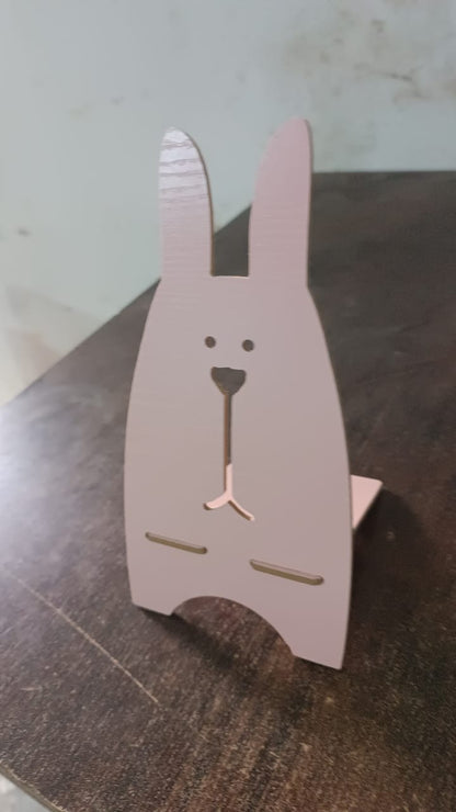 Wooden rabbit-shaped mobile stand by Wukusy, designed for holding smartphones with a charming, cute rabbit motif.