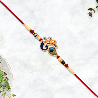 Artistic Mor Pankh Rakhi with colorful enamel and traditional thread, designed for festive celebrations by Wukusy.