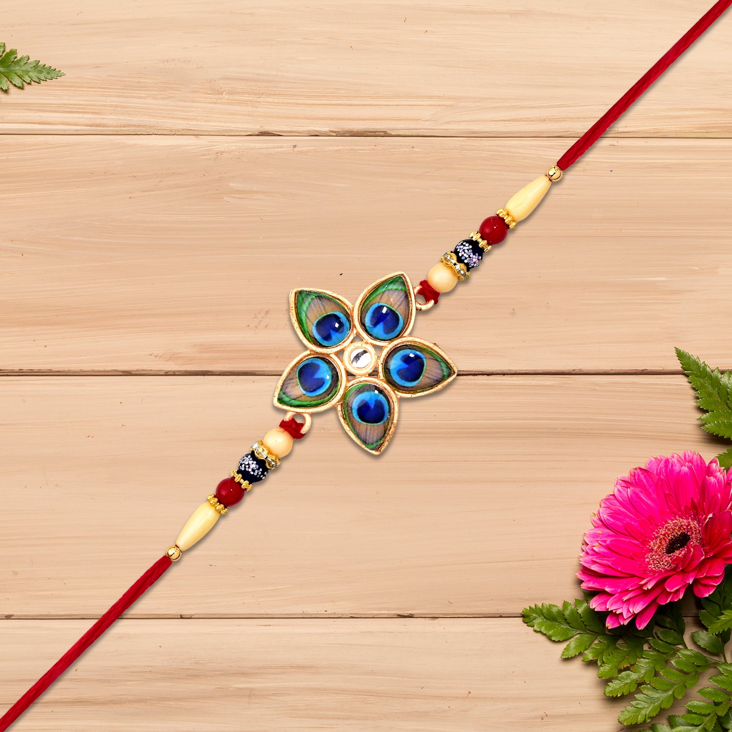 Designer Mor Pankh Rakhi in star shape from Wukusy, featuring intricate fashion jewelry design for festive occasions.