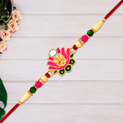 Ganesh lotus leaf designer motif rakhi from Wukusy, showcasing intricate fashion jewelry with traditional religious symbols.