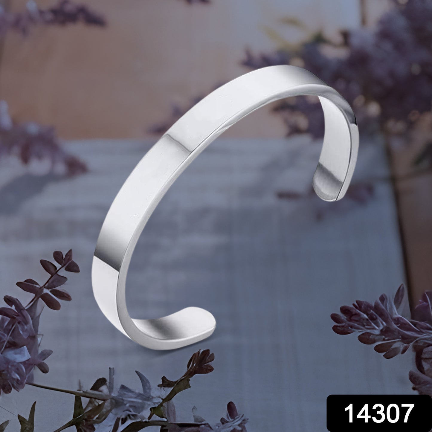 Minimalist silver-tone stainless steel open-ended kada bracelet by Wukusy, showcasing a sleek polished design for fashion wear.