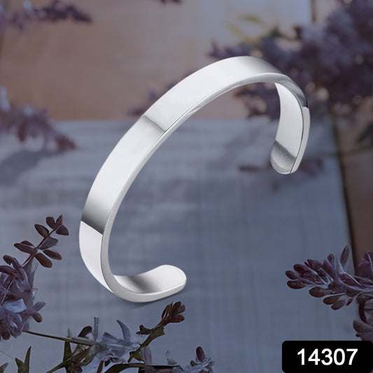 Minimalist silver-tone stainless steel open-ended kada bracelet by Wukusy, showcasing a sleek polished design for fashion wear.
